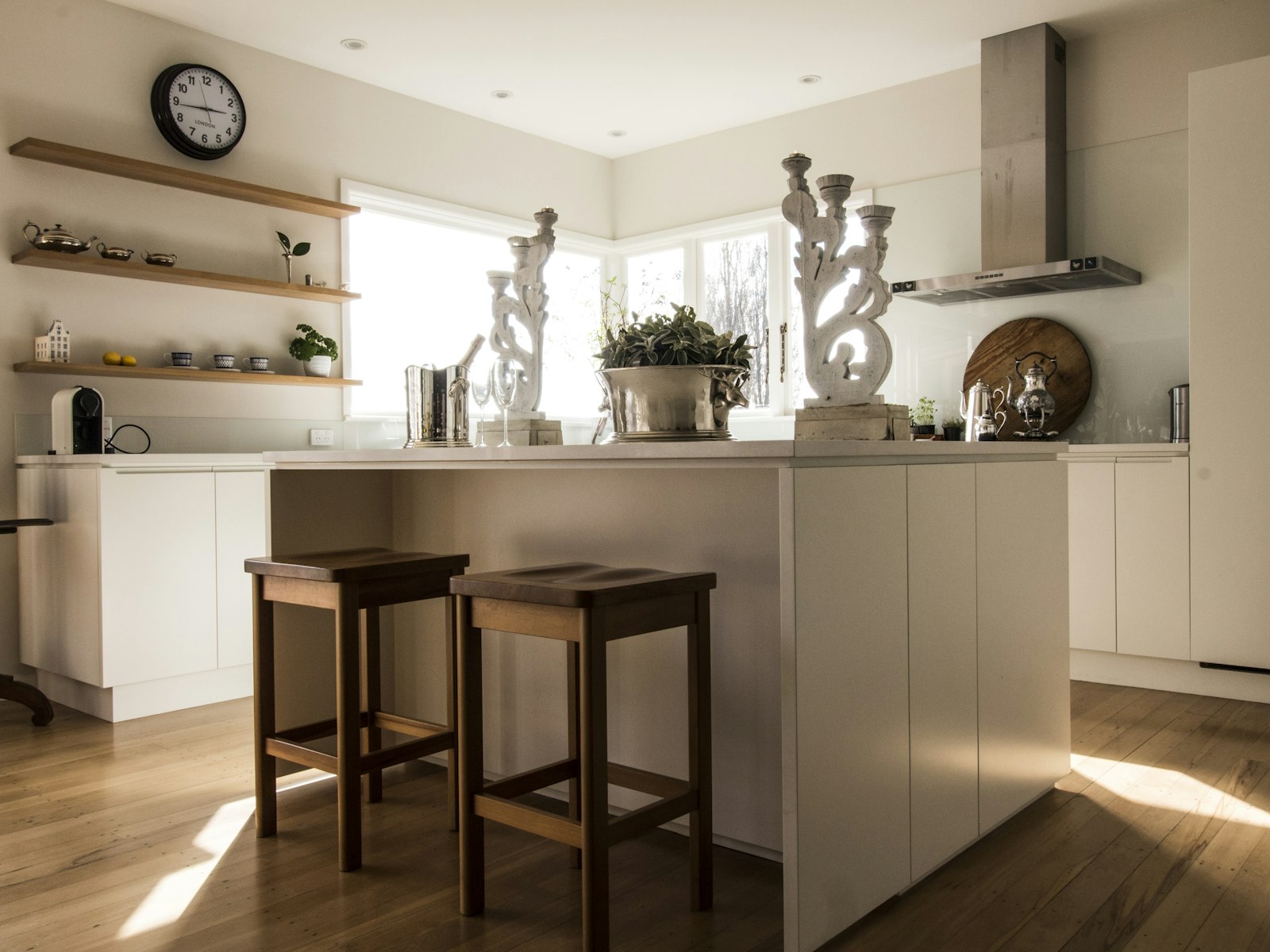 White wooden table and two brown wooden chairs