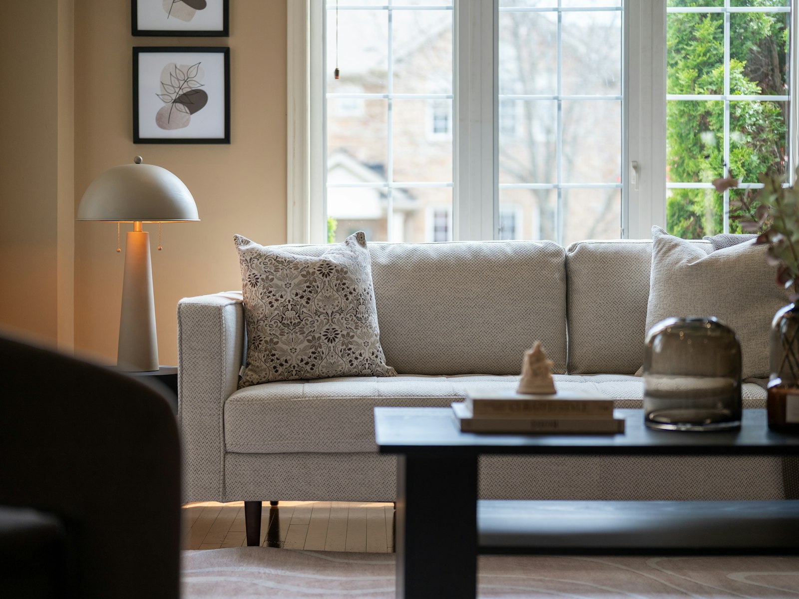 A bright living room with a sofa and coffee table