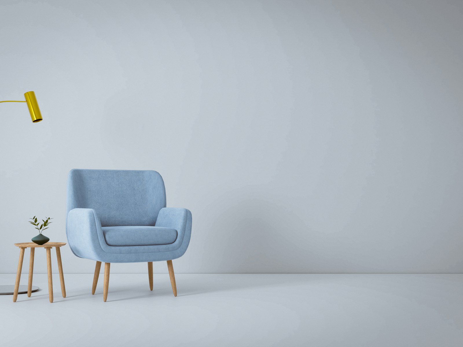 A blue chair and a yellow lamp in a white room