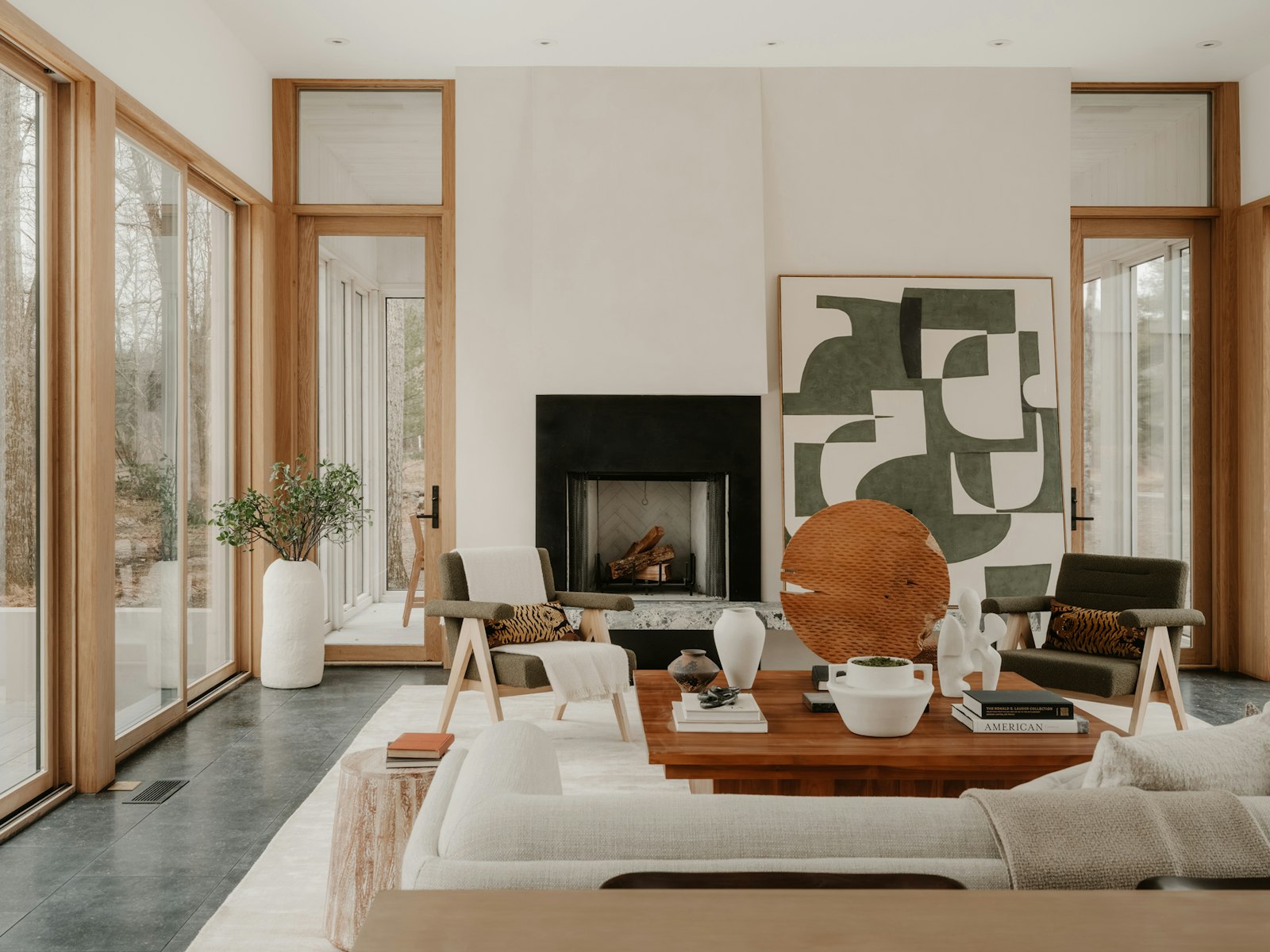 Modern living room with fireplace and large windows