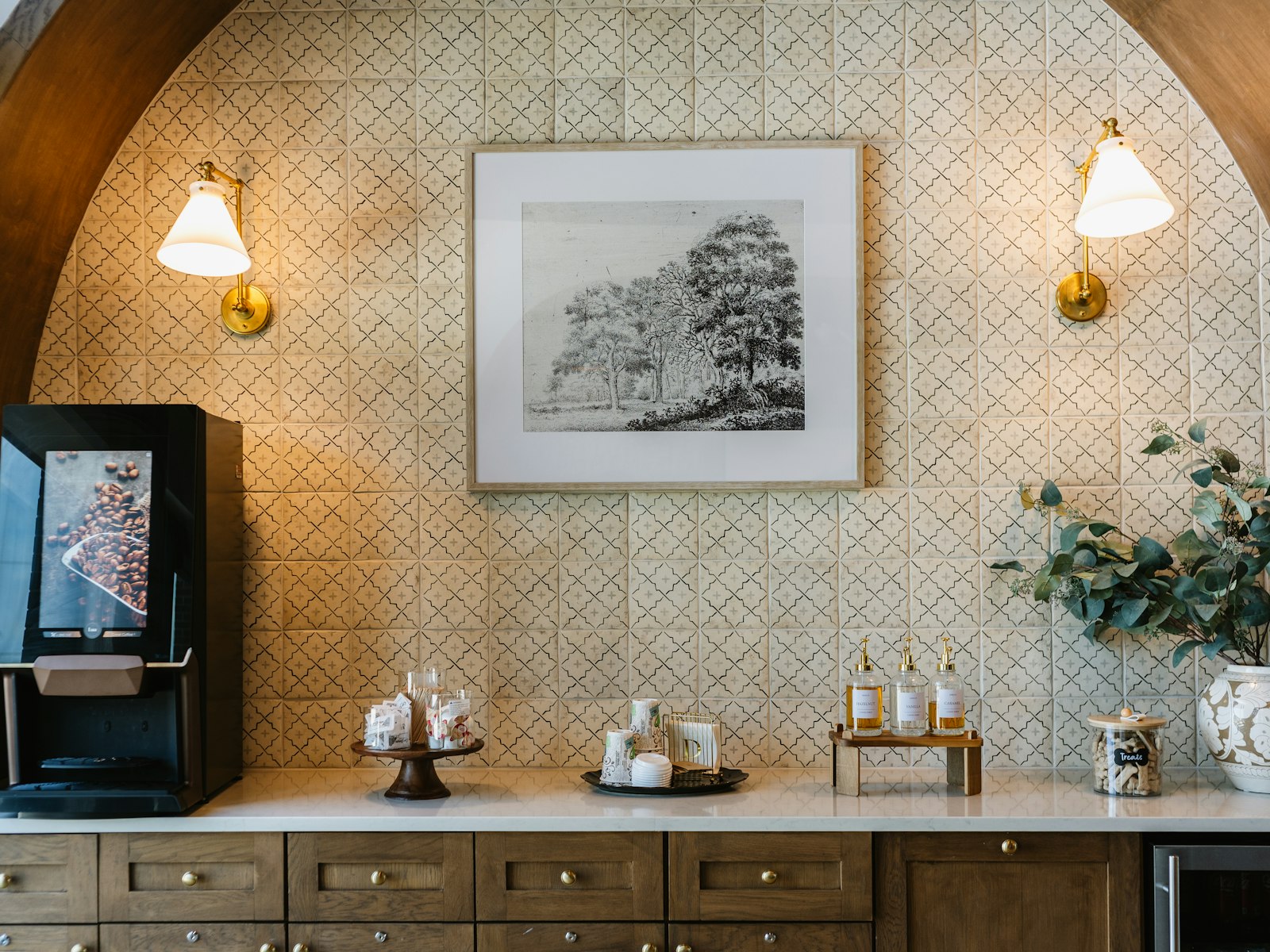 Elegant coffee station with a machine, decor, and framed art