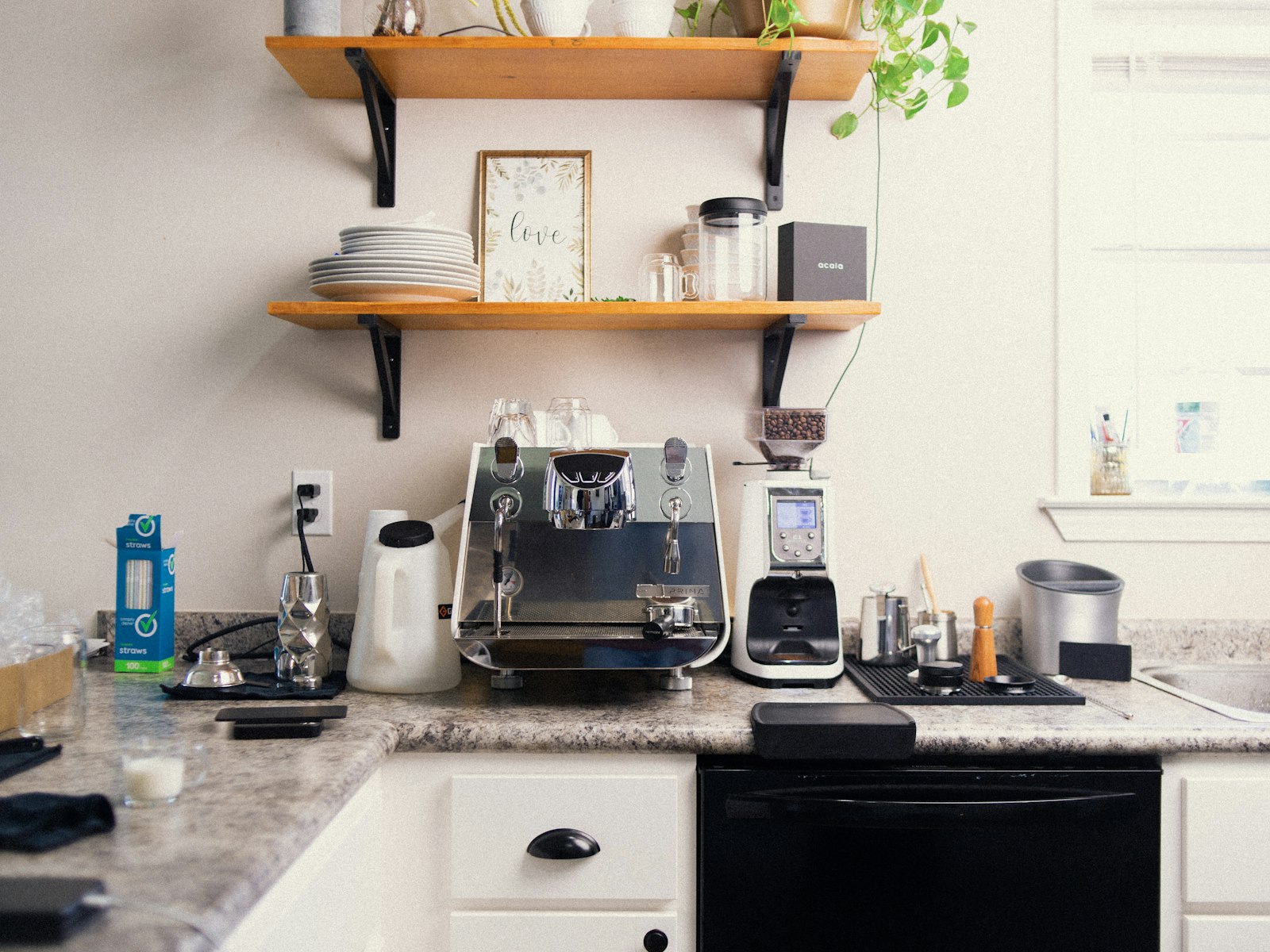 A kitchen counter with a coffee maker and other kitchen items