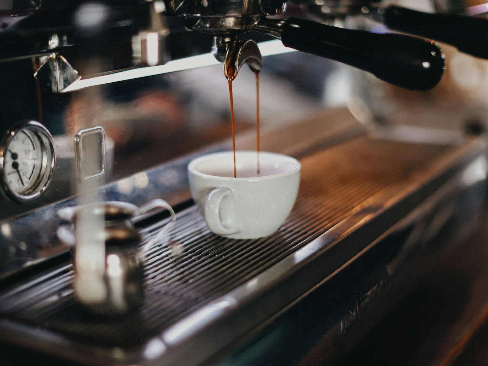 White ceramic cup on brown wooden table