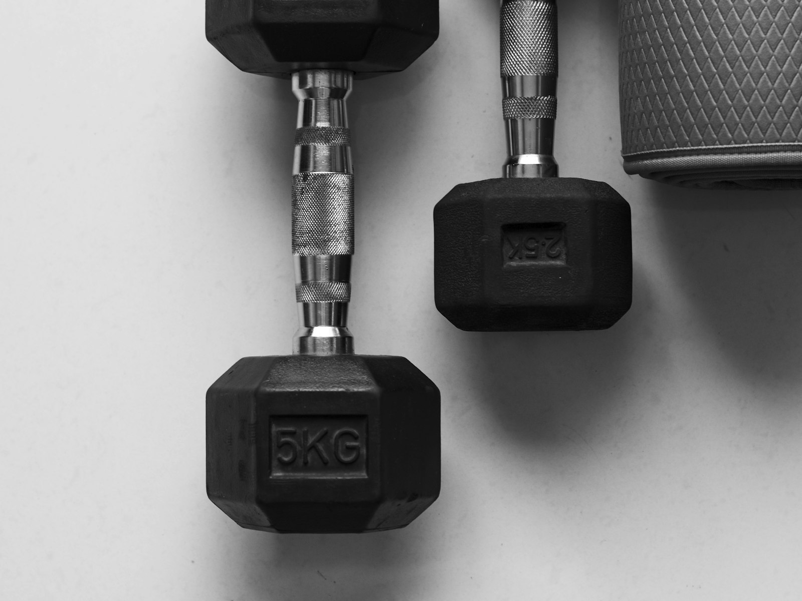 A pair of black dumbbells