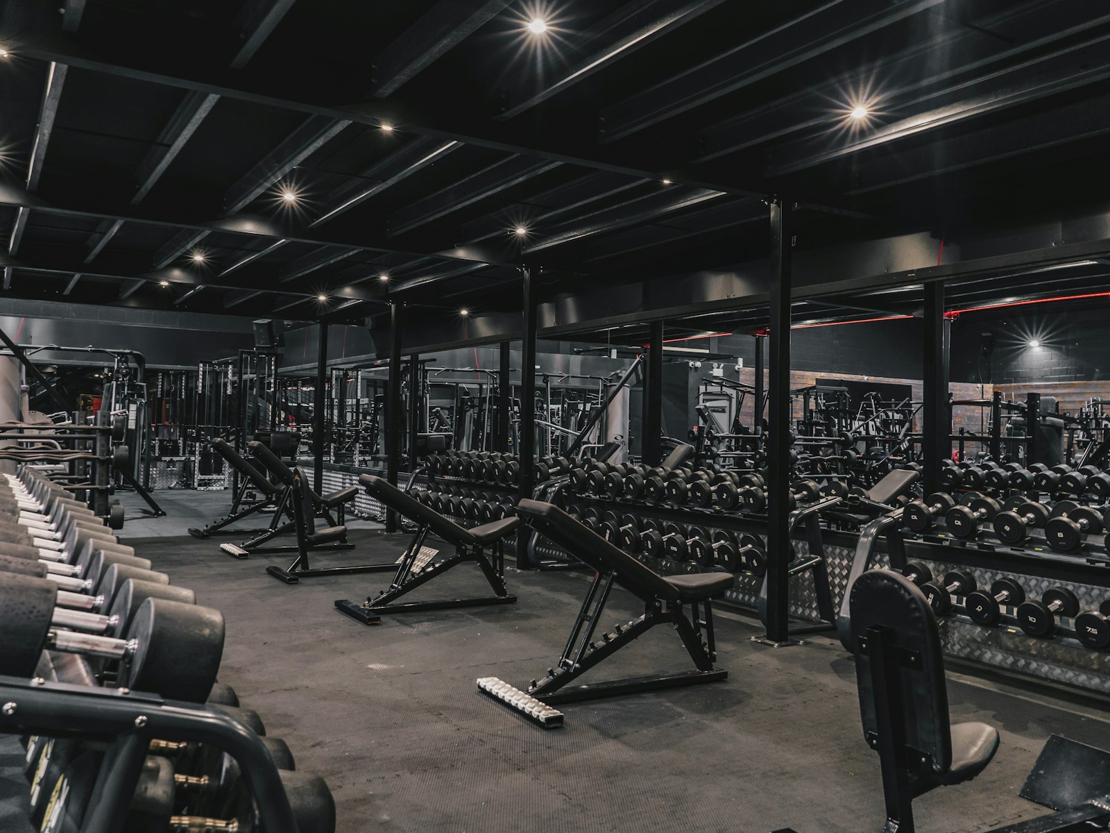 A gym filled with machines and weights