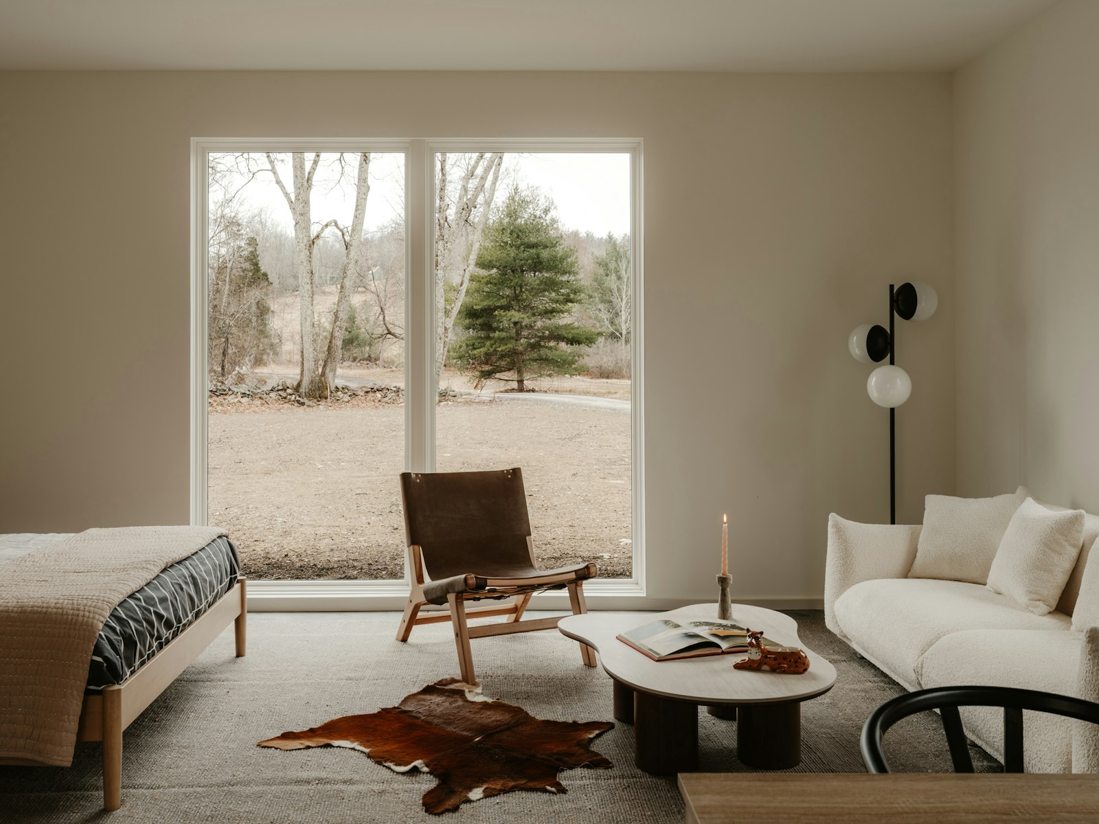 Modern living space with large window overlooking nature