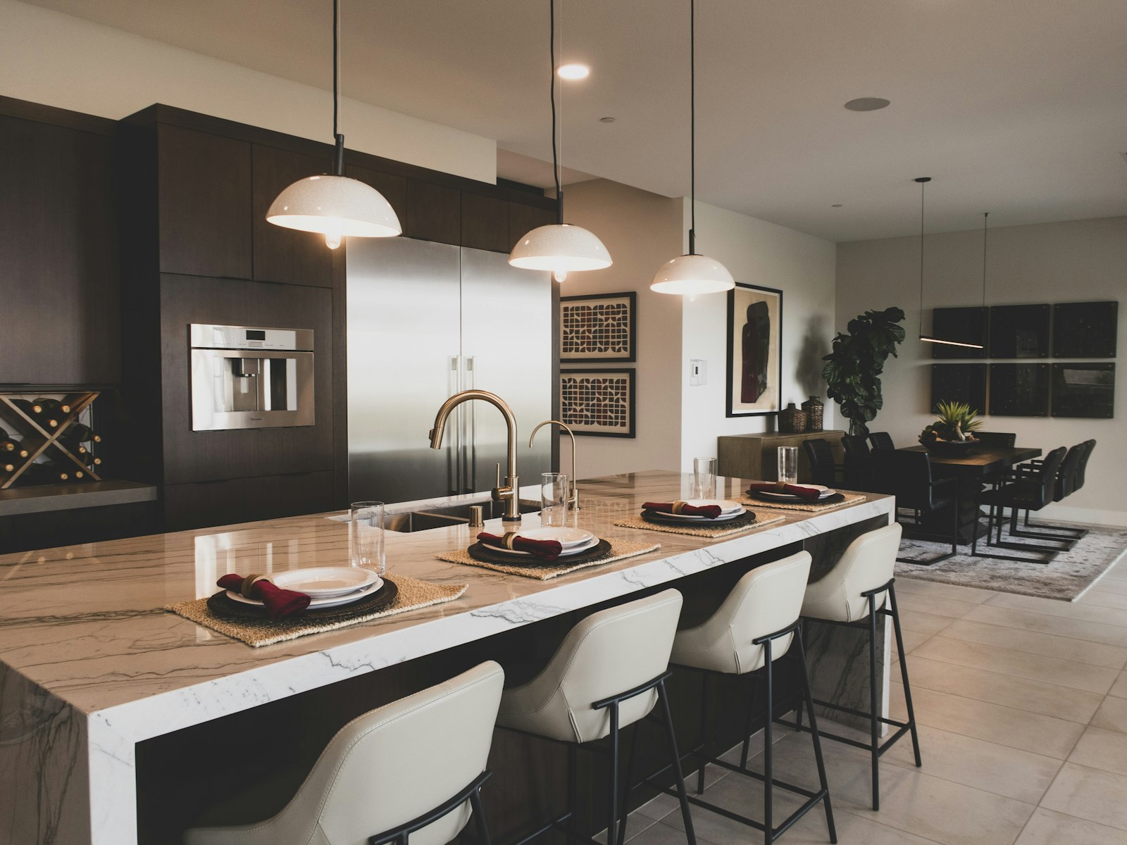 A kitchen with a marble counter top and a center island