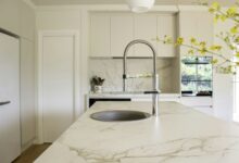 Stainless steel faucet on a marble sink
