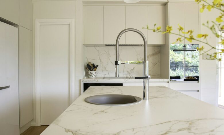 Stainless steel faucet on a marble sink