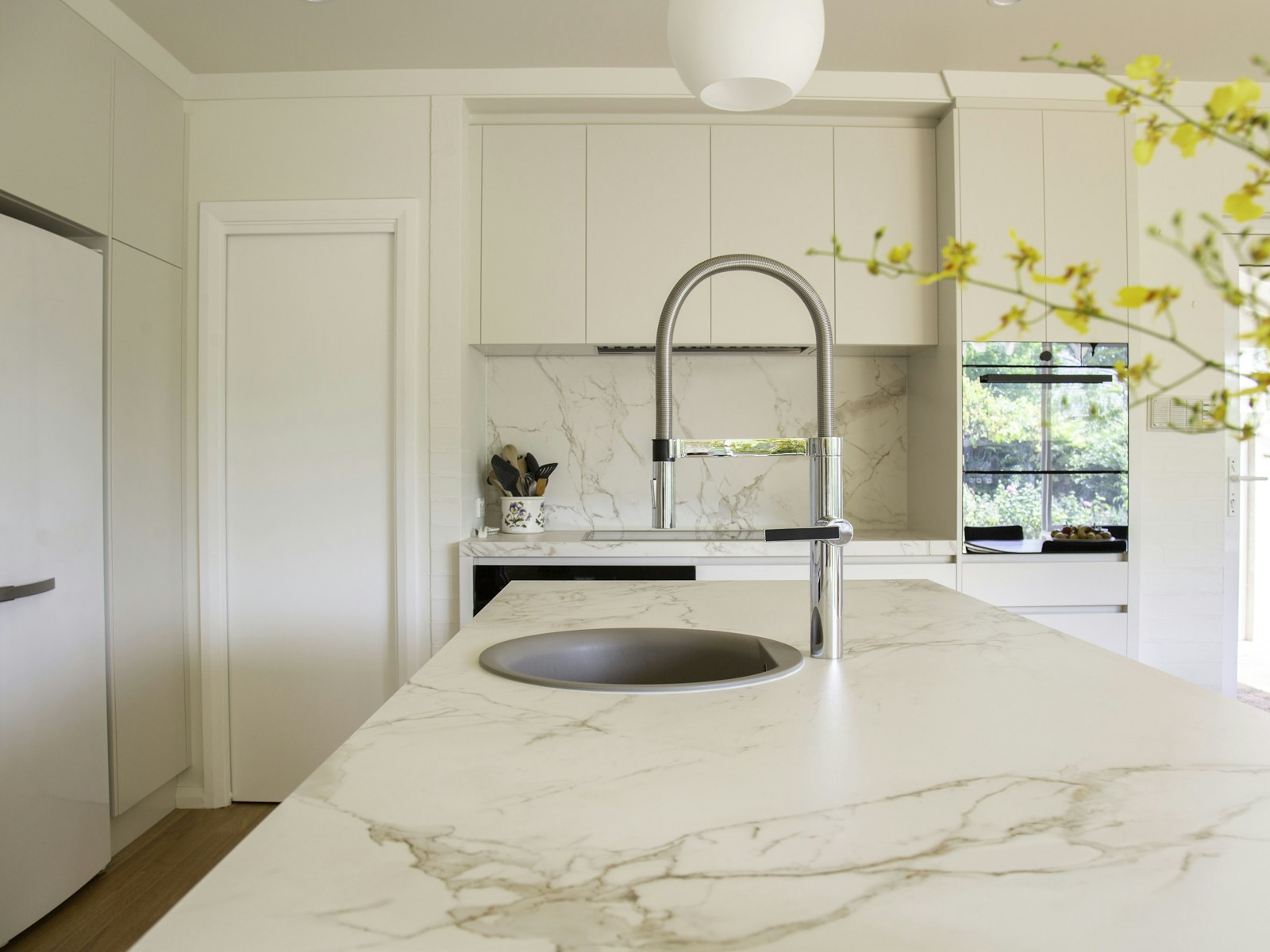 Stainless steel faucet on a marble sink