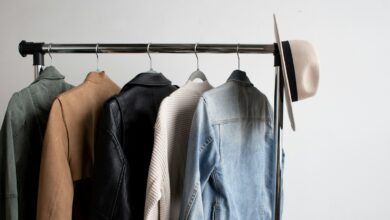 Hat and five jackets hanging on a coat rack
