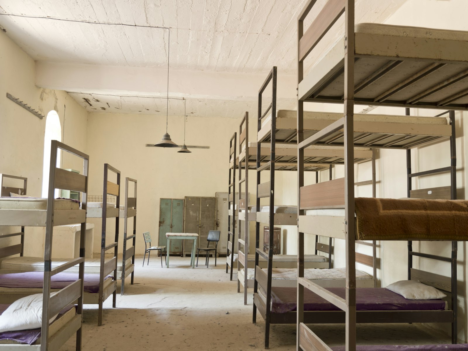 Bunk beds in a dimly lit room