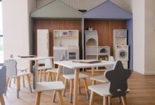 Children's play area with small tables and chairs