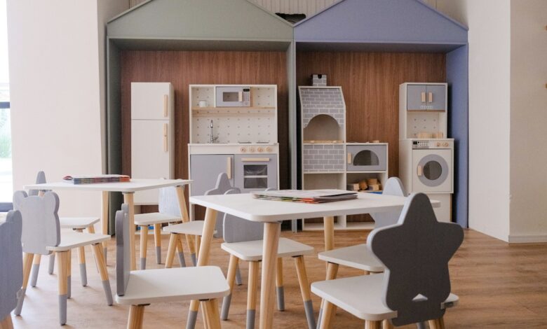 Children's play area with small tables and chairs