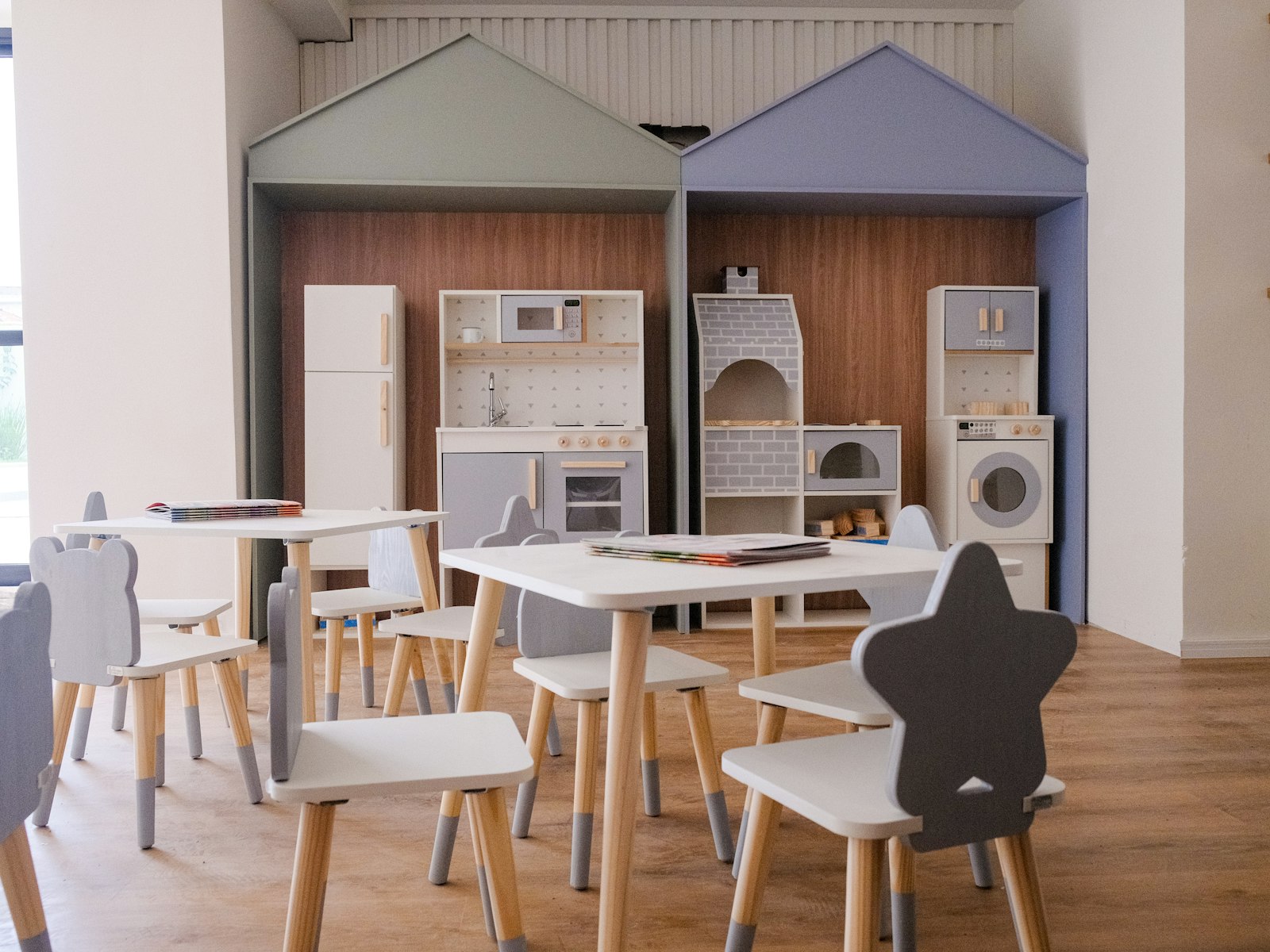 Children's play area with small tables and chairs