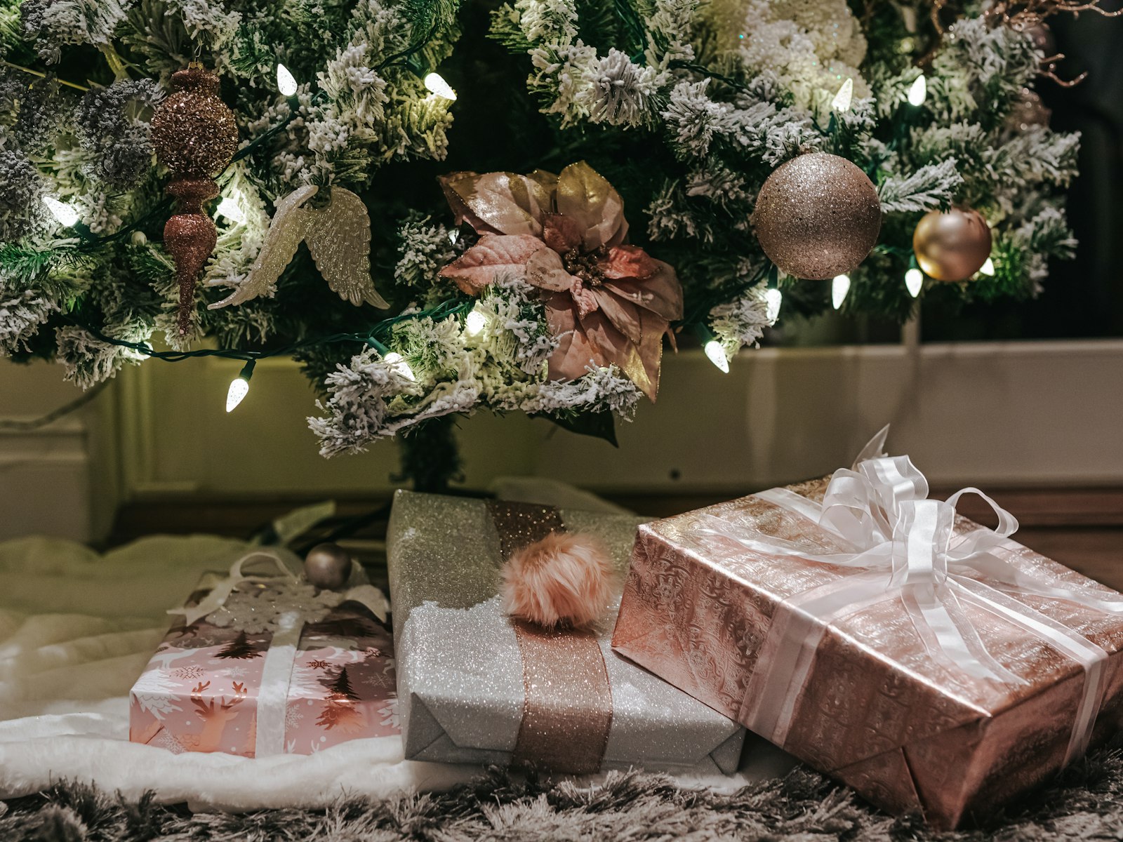 Champagne and blush Christmas tree with metallic gifts wrapped in rose gold paper