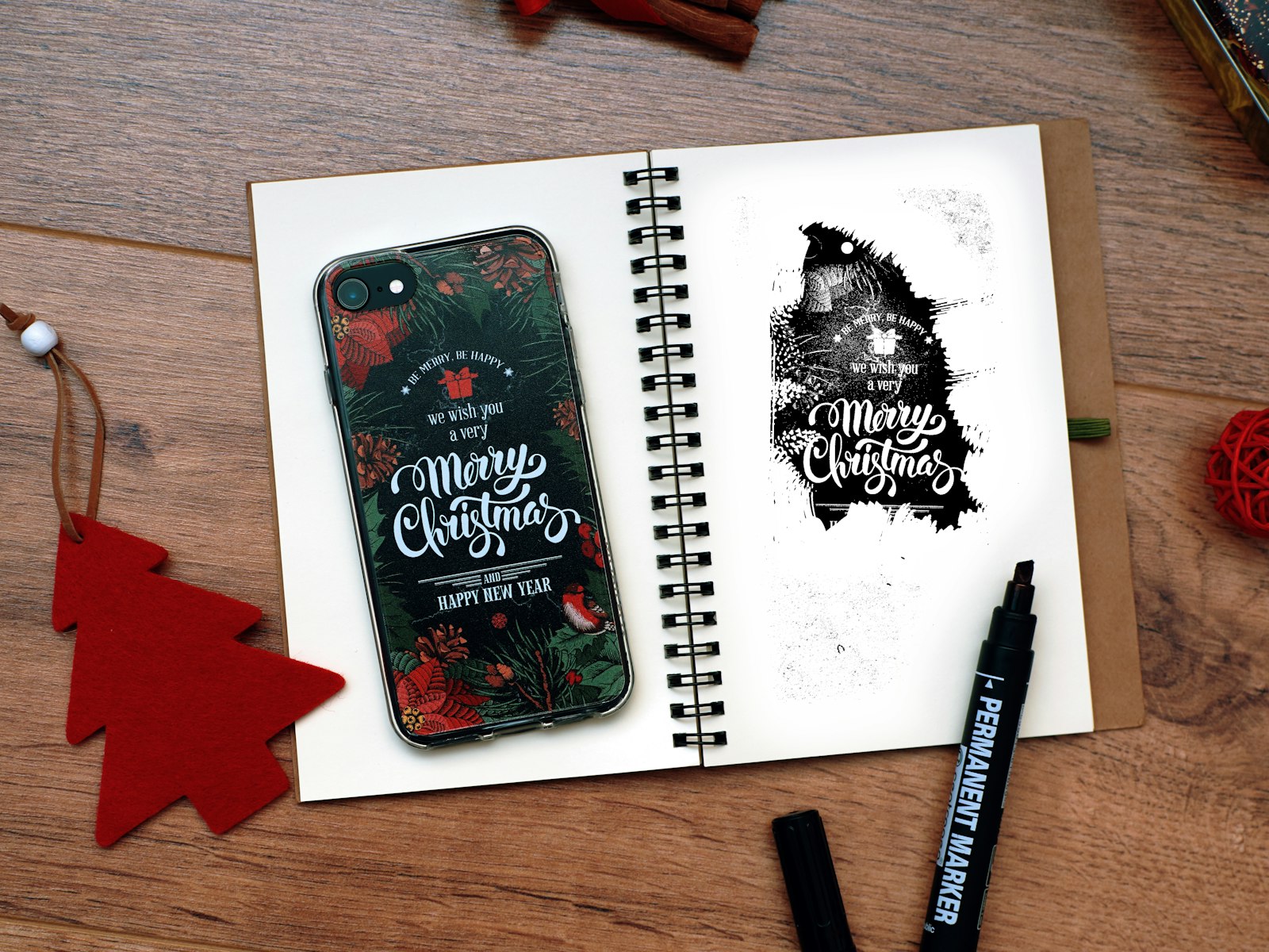 Black and red smartphone near black marker – Christmas office decor idea