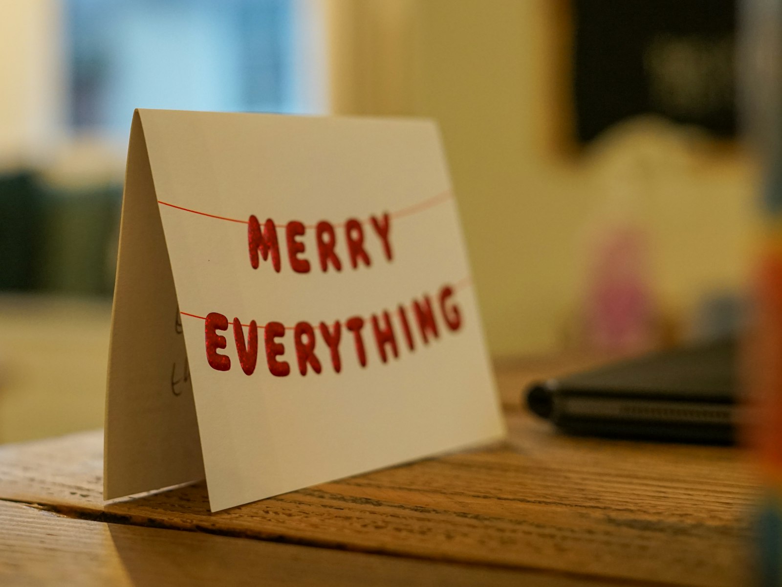 A card that says merry everything on it – Christmas office decor idea