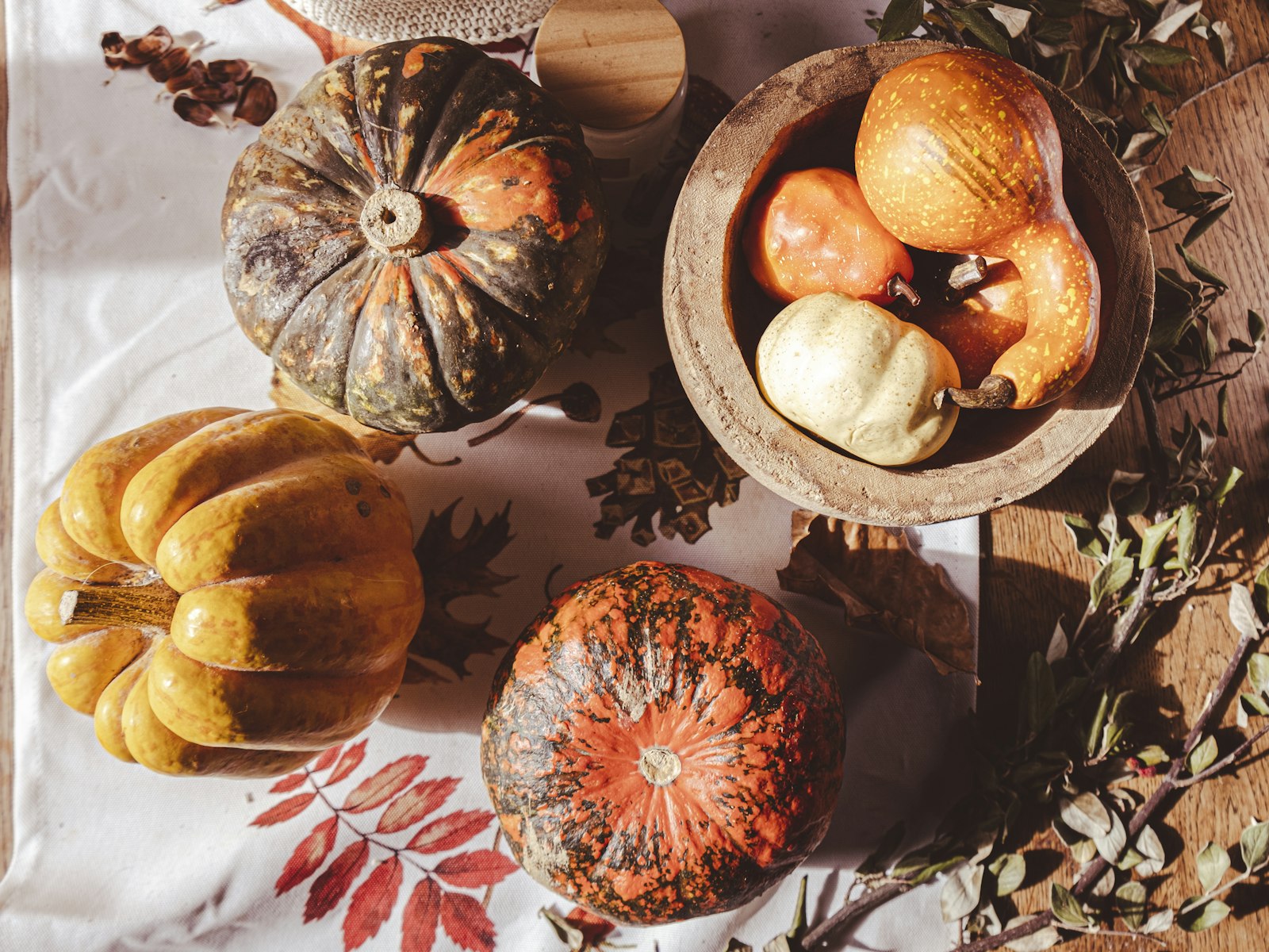 Wooden bowl of heirloom pumpkins and squash as a simple fall centerpiece