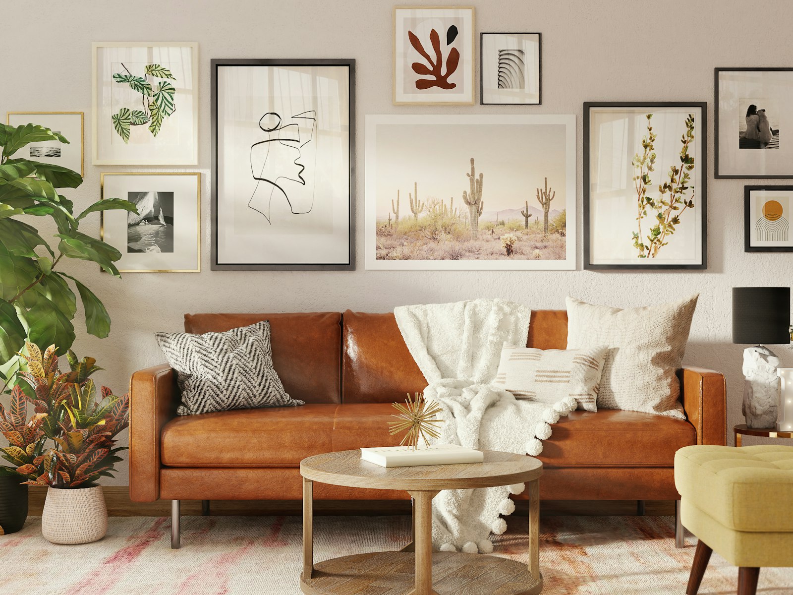 Living room with a gallery wall above a cognac leather sofa